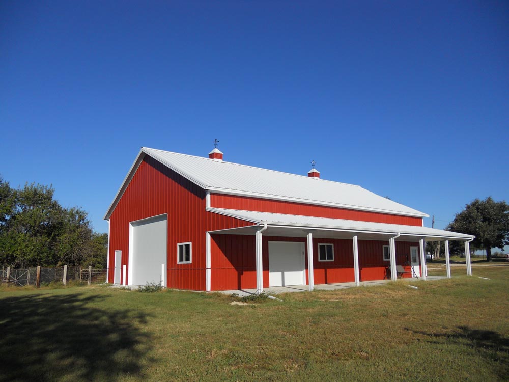 Red metal barn with covered porch